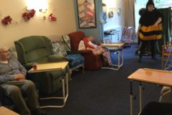 Residents-being-entertained-by-a-comical-panto