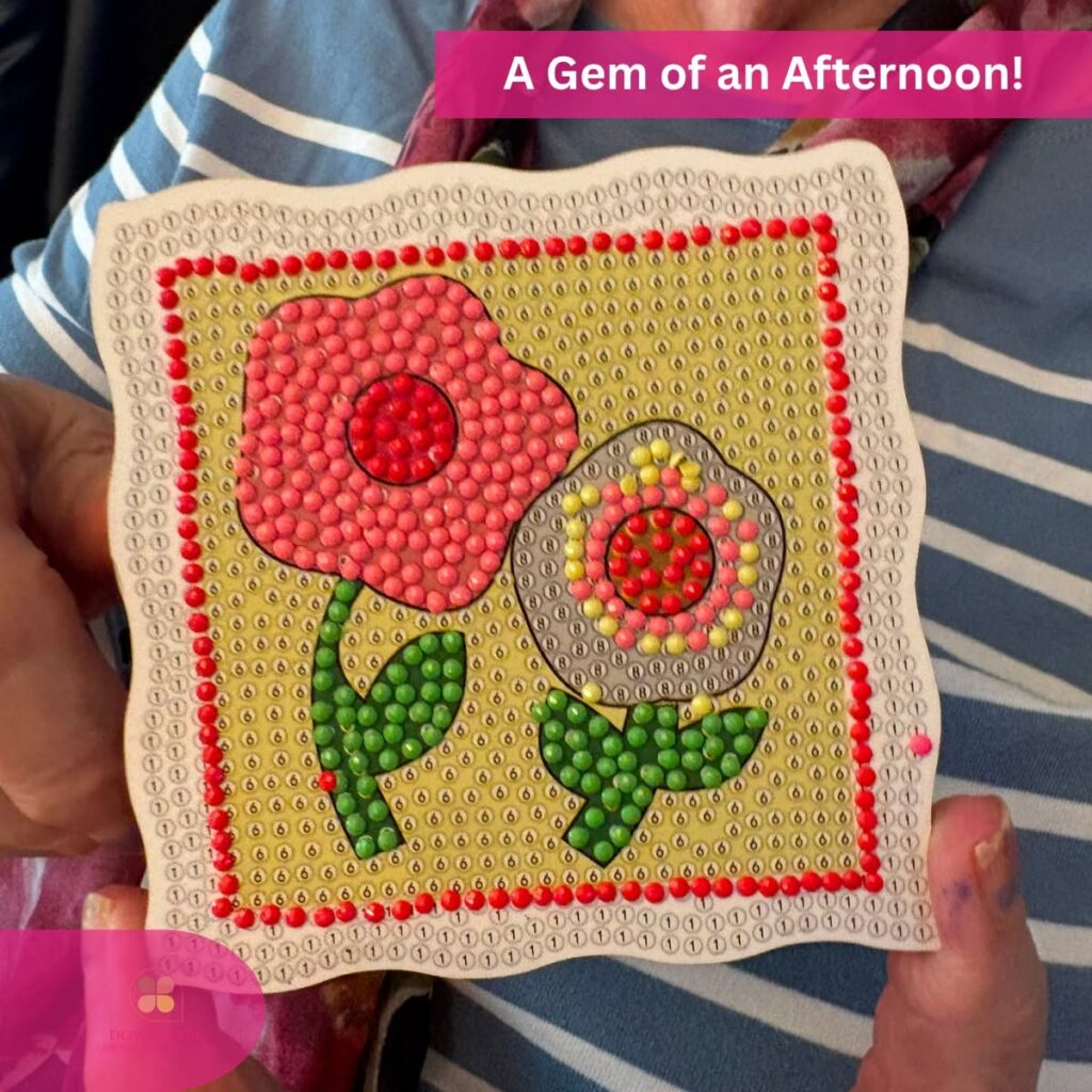 Close-up of a completed flower diamond art craft proudly displayed after a fun afternoon activity.