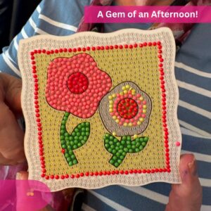 Close-up of a completed flower diamond art craft proudly displayed after a fun afternoon activity.