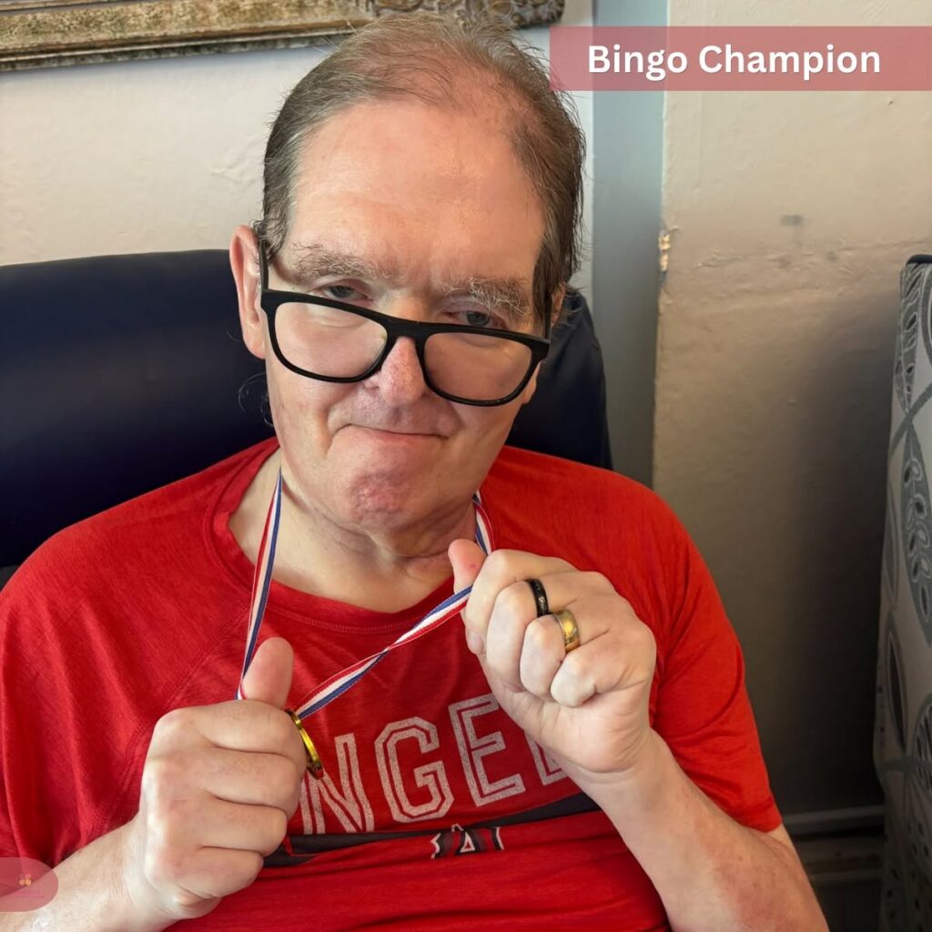 Happy bingo champion holding a medal.