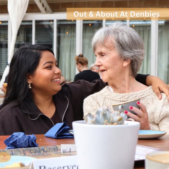 Elderly resident enjoying a day out at Denbies with a care home staff member.